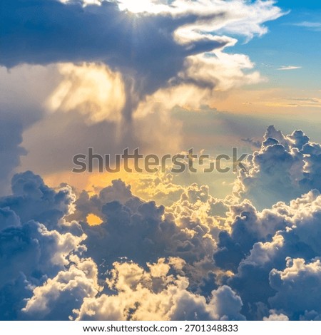 Cloudscape with sun rays breaking through clouds showing divine natural light