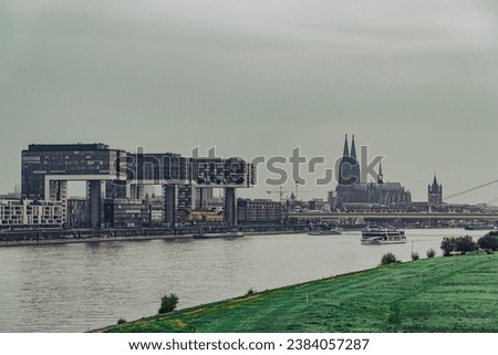 Cloudscape View of Cologne Cathedral, Kranhaus business center and the Rhine River