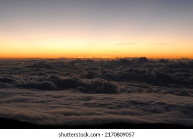 Cloudtops At Orange Sunset Dusk Gradient Seen From Above Horizontally.