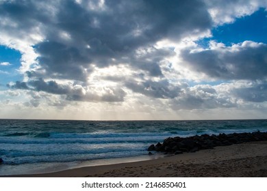 Cloudy Beach Day With Patches Of Sunlight 