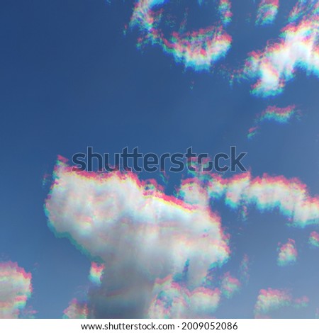 Cloudy blue skies with glitch effects. 