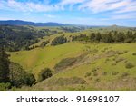 Cloudy blue sky over green hills of Marin County, California