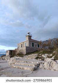 cloudy evening sky over the lighthouse on the adriatic coast