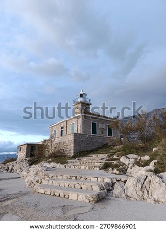 cloudy evening sky over the lighthouse on the adriatic coast