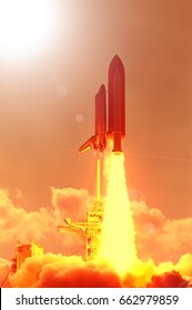 Cloudy launch of rocket into  outer space. 