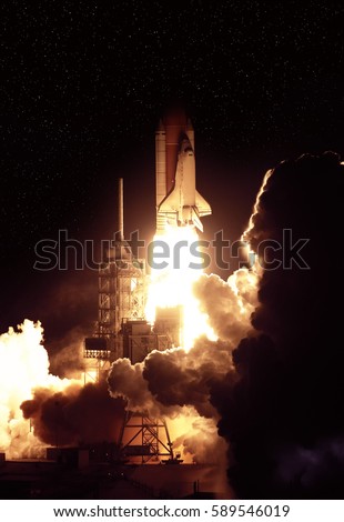 Cloudy launch of rocket into  outer space. 