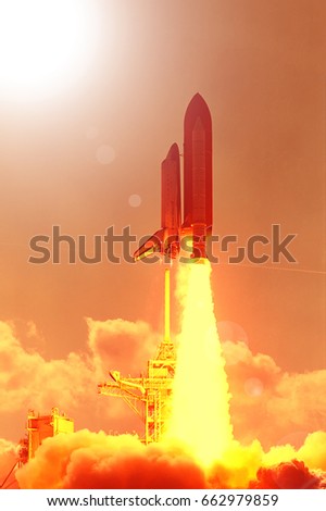 Cloudy launch of rocket into  outer space. 