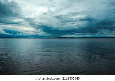 Cloudy Rainy Weather. Beautiful Dark Dramatic Sky And Lake.