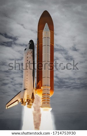 Cloudy rocket launch. The elements of this image furnished by NASA.