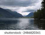 Cloudy scenic mountain range at glacier national park, lake McDonald