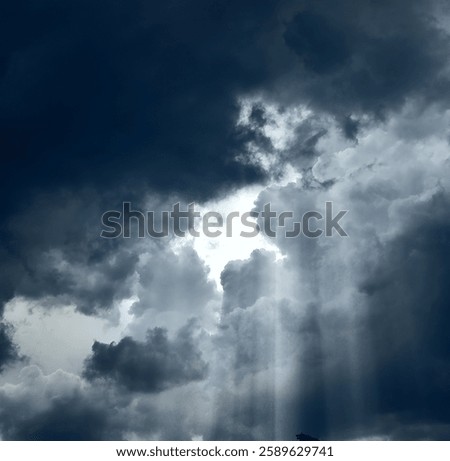 Cloudy Skies with Sunlight Piercing the Clouds