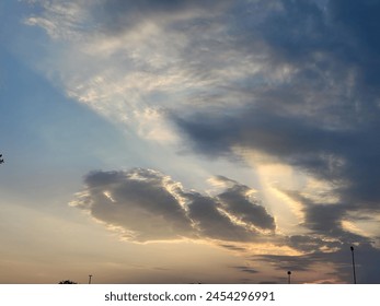 A cloudy sky can be a mesmerizing sight, casting a veil of mystery and drama over the landscape. Picture a vast expanse of atmosphere, where billowing clouds drift lazily or race across the heavens
