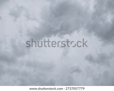 A cloudy sky with dark gray clouds covering the entire frame, suggesting an overcast day or approaching storm.
