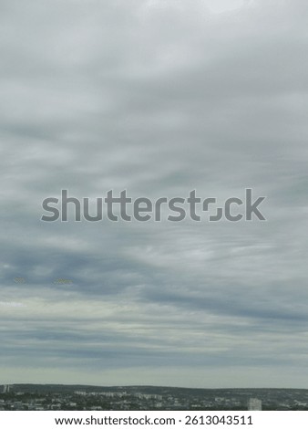 Cloudy sky with fluffly white clouds 