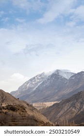 Cloudy sky over mountain range landscape