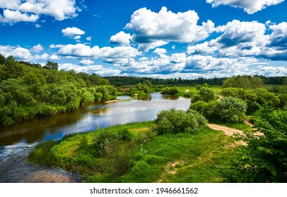 Cloudy sky over river on summer nature landscape - Shutterstock ID 1946661562