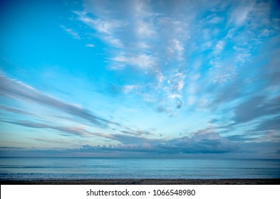 Cloudy sky over the sea in the evening light