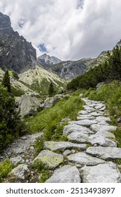 Cloudy sky path through Mala Studena dolina Valley in Tatry mountains Slovakia.