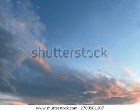 Cloudy sky skyscape with light rays at sunset