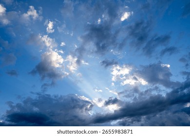 Cloudy sky with sun rays