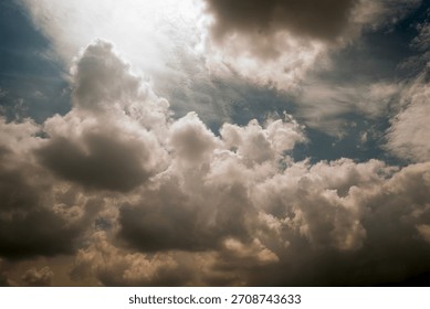 Cloudy sky with thick clouds and a sliver of sunlight