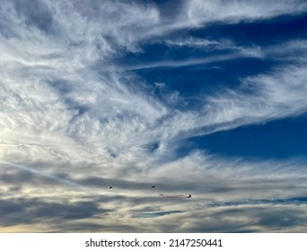 Cloudy Sky With Three Kites