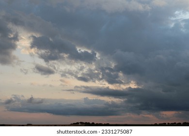 A cloudy sky with trees