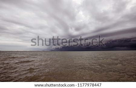 Cloudy storm in the sea before the rain. tornado storms cloud above the sea. Monsoon season. Hurricane Florence. Hurricane Katrina.