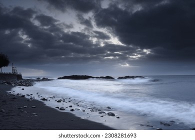 Cloudy sunset by the ocean