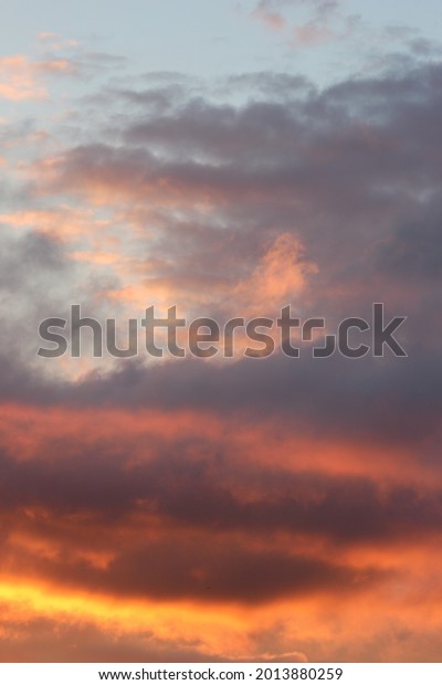Cloudy sunset divides the\
sky