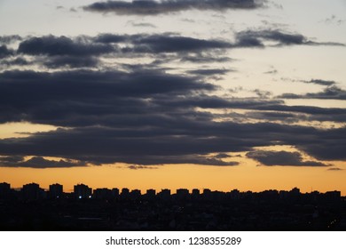 Cloudy sunset with skyline