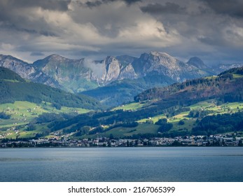 Cloudy view of the city of Lachen and the alps from the Upper Zurich Lake (Obersee), Schwyz, Switzerland