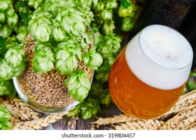 Cloudy Wheat Beer And Ingredients In Glasses