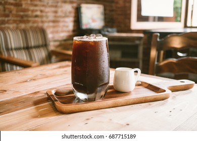 clouse up fresh ice coffee (cold americano) in coffee shop background.
