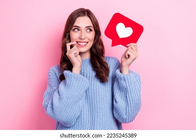Clouseup photo of lady wear blue knitted jumper bite nail dreamy look mockup youtube channel hold like symbol isolated on pink color background
