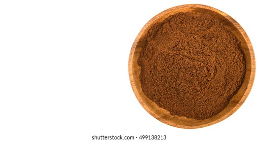 Clove Powder In Wooden Bowl Over White Background