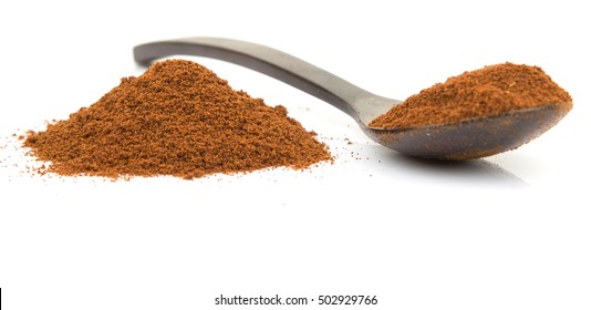 Clove Powder In Wooden Spoon Over White Background