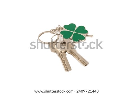 Clover keychain with key ring isolated on white background. Concepts for real estate and moving home or renting property. Buying a property. Mock-up keychain.Copy space.