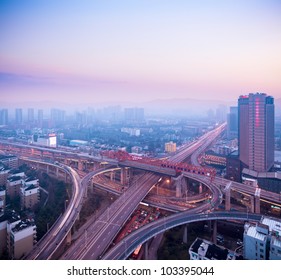 Cloverleaf Interchange At Dusk,urban Traffic Concept