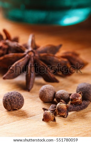 Dried poppy seed capsules on an old metal plate