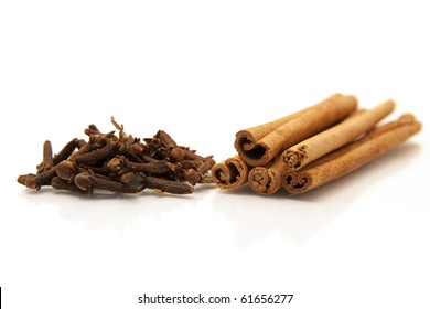 Cloves And Cinnamon Sticks On White