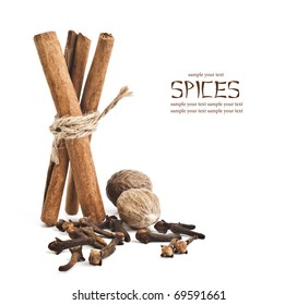 Cloves And Cinnamon Sticks On White