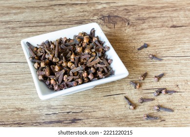 Cloves In A Small White Ramekin.