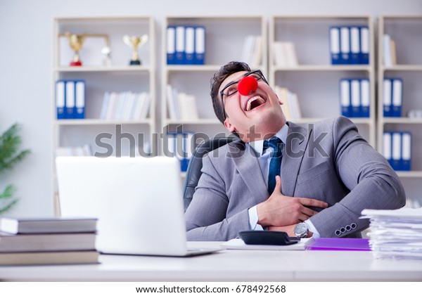 Clown businessman\
having fun in the office