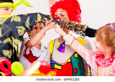 Clown At Children Birthday Party Entertaining The Kids