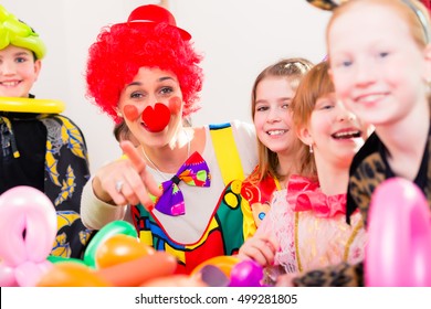 Clown At Children Birthday Party Entertaining The Kids