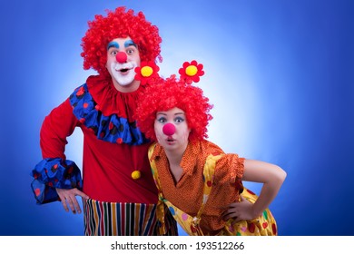 Clown Couple Costumes On Blue Background Stock Photo (Edit Now) 194855471