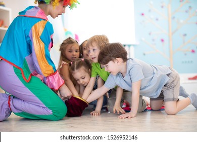 Clown Entertaining Preschool Kids On Birthday Party. Games With Animator