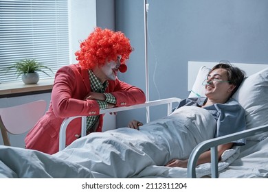 Clown Entertaining The Sick Woman At Ward