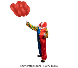 A Clown Holds Red Ballons In His Hand